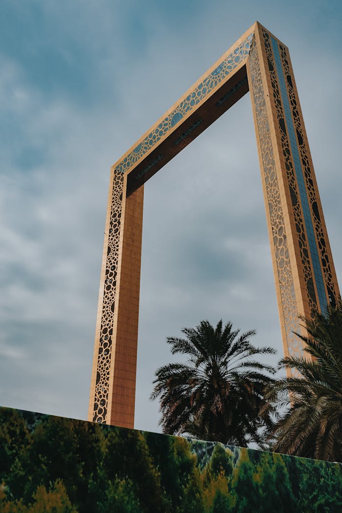 From below exterior of creative contemporary construction build in shape of rectangular  photo frame in Dubai UAE on clear hot day